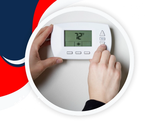 Technician checking thermostat during AC repair service in Allen, TX.